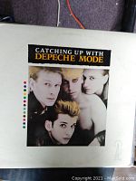 Poster showing four members of Depeche Mode, titled 'Catching Up With Depeche Mode', with the Sire Records logo in bottom right corner.