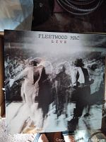 Front cover of Fleetwood Mac Live vinyl record showing blurred image of band members performing live.