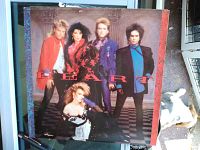 Front cover of Heart 1980s vinyl record album showing band members and logo.
