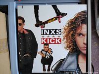 Front cover of the 1987 INXS Kicks vinyl record by Atlantic Records showing members of the band and album title.