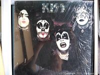 Front cover of Kiss album showing the four band members with distinctive face paint and costumes.