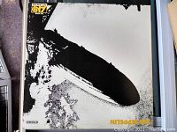 Front cover of Led Zeppelin vinyl LP record showing black and white zeppelin airship image with Atlantic Records logo and catalogue number.