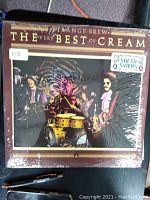 Front cover of The Very Best of Cream vinyl LP with band photo and album title.