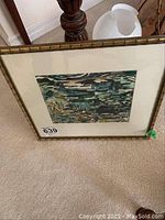 Framed original watercolour painting with visible signature and date in lower right corner, depicting abstract or nature-inspired scene with dominant green and blue tones.