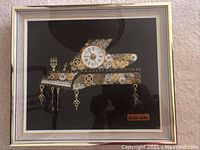 Full front view of framed horological piano collage showing clock face and frame