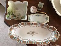 All five Nippon china pieces arranged on a table: rectangular tray, small square dish, oblong dish, round box, and square box.