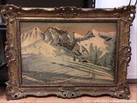 Full view of framed oil painting showing winter mountain landscape