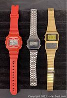 Three vintage Casio men's digital watches placed side by side, showing overall condition and design differences.