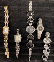 All 5 vintage ladies watches on black background showing different styles and metal bands.