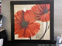 Front view of framed floral oil painting by Alicia Soave, showing two large red flowers on neutral background.