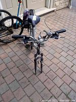 Front view of the bicycle showing missing front tire, handlebars, and front fork