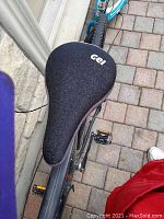 Close-up of black gel seat cover installed on bike saddle