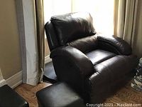 Photo showing the power recliner and ottoman side by side, highlighting overall shape and material.