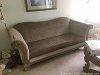 Full view of tan velour three-seater couch showing general condition and overall shape.