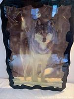 Full view of the laminated wolf image on plywood with black wavy border.