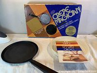 Photo showing Popeil Crepe Magician crepe maker pan, original box, and cookbook
