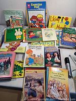 Overview of two dozen plus young children's books including Sea Otter Pup, Exercise Pad, Liking Myself, and various others.