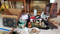 Photo showing the collection of cat-themed ceramic figurines, mugs, decorative trays, and wooden key display included in the lot.