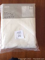 Packaged new IKEA Anita drapes in original plastic packaging showing product label.