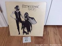 Front cover of Fleetwood Mac Rumours vinyl album showing title and artwork.