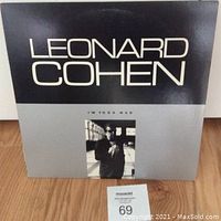 Front cover of Leonard Cohen 'I'm Your Man' vinyl album showing title and artist name with a photo of Leonard Cohen.