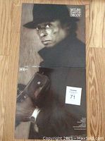 Front and back of the Miles Davis Decoy vinyl LP sleeve with visible wear, displayed on wood floor.