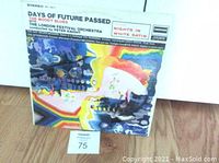 Front cover of the vinyl LP Days of Future Passed by The Moody Blues showing colorful psychedelic artwork, album title, and artist name.