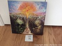 Front cover of The Moody Blues vinyl album titled 'In Search of the Lost Chord' with colorful psychedelic artwork.