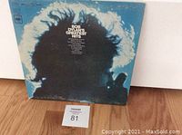 Front cover of Bob Dylan's Greatest Hits vinyl LP showing silhouetted profile of Bob Dylan with blue sky background.