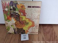Front cover of the vinyl album showing colorful floral and psychedelic artwork and the name Joni Mitchell