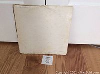 Front of The Beatles The White Album double vinyl LP cover showing wear and discoloration.
