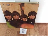 Front cover of Beatles "Beatles for Sale" vinyl LP album showing a close-up image of the four band members.