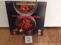 Front cover of the In-A-Gadda-Da-Vida LP album by Iron Butterfly, showing colorful artwork and title text.