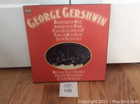 Front cover of George Gershwin boxed set album with red cover and gold lettering