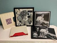 Full view of Mickey Hart Planet Drum box set, Lionel Hampton Victor Sessions 1937-1941 set, and music-themed framed wall art.