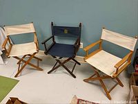 View of all three directors chairs showing their different wood finishes and canvas colors