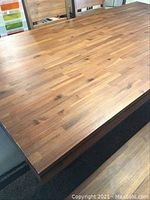 Top view of butcher block style wood dining table