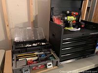 Husky tool chest and portable tool carrier with multiple hand tools inside, keys attached.