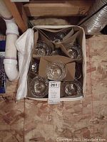 Top view showing 10 Waterford crystal sherbet dishes packaged in a box with cardboard separators.