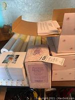 Stack of six original doll boxes including Precious Moments Niblette and Ashton-Drake Galleries branding