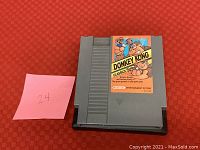Front of NES Donkey Kong Classics cartridge showing the game label and gray plastic casing.