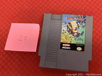 Front side of Nintendo NES cartridge The Simpsons Bart Simpson vs. the World showing label with Bart Simpsons artwork.