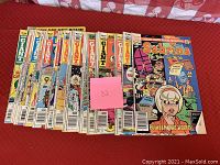 Photo showing multiple Archie Giant Series comics including Sabrina the Teenage Witch issue and others lined up on a surface.