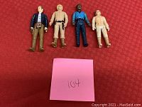 Four 1980 Star Wars 4-inch action figures laid out on red fabric background including Han Solo, Bespin Luke Skywalker, Lando Calrissian, and Bespin Chewbacca. Photo shows general condition and character details.