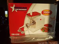 Box front showing OMCAN Food Machinery SM-G50 model with 350W input power and images of the grinder and accessories.