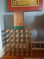 Wood and metal wine rack showing the 25-bottle capacity grid design