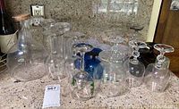 Overview of glassware assortment including carafe and multiple glasses of varied shapes and sizes