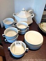 Photo of soup tureen, stacked bowls and plates showing condition and style