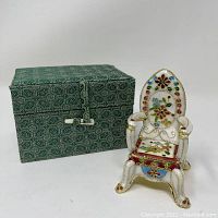 Miniature cloisonné chair with matching decorative box, showcasing colors and details.