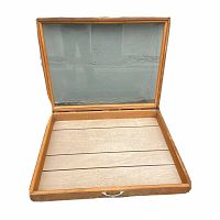 Open wooden display case showing glass lid hinged at back and wooden slat base inside